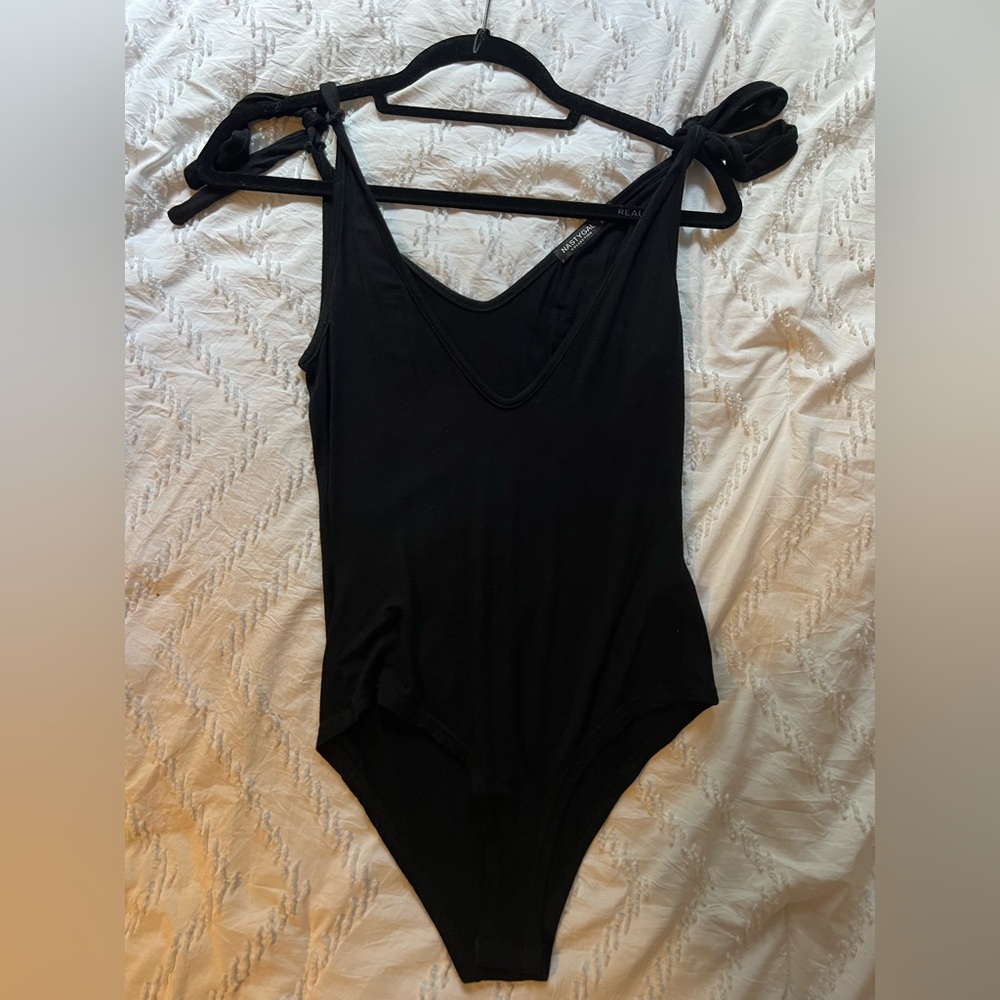 Extremely soft black bodysuit tie at the shoulders.